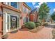 Elegant front entrance with a brick walkway and manicured greenery at 1558 Amberwood Creek Nw Dr, Kennesaw, GA 30152