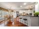 Eat in kitchen featuring a breakfast bar and wood floors at 1558 Amberwood Creek Nw Dr, Kennesaw, GA 30152