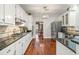 Well-appointed kitchen boasting stainless appliances, granite countertops, and hardwood floors at 1558 Amberwood Creek Nw Dr, Kennesaw, GA 30152