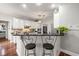 Bright kitchen featuring white cabinets and a convenient breakfast bar with seating at 1558 Amberwood Creek Nw Dr, Kennesaw, GA 30152