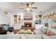Cozy living room with a brick fireplace, built-in shelving, and comfortable seating at 1558 Amberwood Creek Nw Dr, Kennesaw, GA 30152
