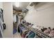 Spacious walk-in closet provides plenty of room for storage with shelving, rods, and compartments at 1558 Amberwood Creek Nw Dr, Kennesaw, GA 30152