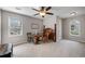 Spacious bedroom with a ceiling fan, carpet, and furniture arranged as a sitting area at 1558 Nw Amberwood Creek Nw Dr, Kennesaw, GA 30152