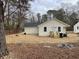 Home's backyard features a new white fence, and wood porch at 5385 Booker T Dr, Morrow, GA 30260