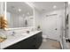 Modern bathroom with double vanity, illuminated mirror, and glass-enclosed shower at 788 W Marietta Nw St # 116, Atlanta, GA 30318