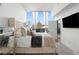 Bright bedroom features a plush bed and large window with natural light at 788 W Marietta Nw St # 116, Atlanta, GA 30318
