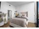 Bright bedroom features a plush bed, modern decor, and ensuite bathroom access at 788 W Marietta Nw St # 116, Atlanta, GA 30318