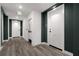 Hallway showcasing gray wood floors and doors to resident units at 788 W Marietta Nw St # 116, Atlanta, GA 30318