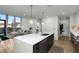 Modern kitchen with large island, stainless steel appliances, and an open layout connecting to the living space at 788 W Marietta Nw St # 116, Atlanta, GA 30318