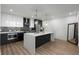 Modern kitchen with a large island, stainless steel appliances, and ample counter space, perfect for cooking and entertaining at 788 W Marietta Nw St # 116, Atlanta, GA 30318