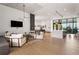 Inviting lounge area with cozy seating, a modern kitchen, and a large television screen at 788 W Marietta Nw St # 116, Atlanta, GA 30318