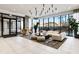 Bright resident lounge with full-length windows and comfortable seating at 788 W Marietta Nw St # 116, Atlanta, GA 30318