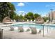 Refreshing swimming pool featuring comfortable white chaise lounges and a city skyline at 788 W Marietta Nw St # 116, Atlanta, GA 30318