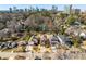 Overhead shot of neighborhood houses with tree-lined streets and well-manicured front yards and a city skyline at 2348 Loraine Street Ne St, Atlanta, GA 30319