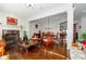 Bright living room with hardwood floors, fireplace, and large windows; open to the dining room at 2348 Loraine Ne St, Atlanta, GA 30319