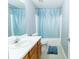 Bathroom with tiled floor, vanity and bath with shower at 2974 Michelle Lee Dr, Dacula, GA 30019