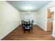 Elegant dining room featuring a large table with seating for six and chandelier light fixture at 2974 Michelle Lee Dr, Dacula, GA 30019