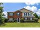 Charming two-story home featuring a brick facade, well-manicured lawn, and colorful landscaping at 2974 Michelle Lee Dr, Dacula, GA 30019