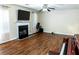 Inviting living area featuring hardwood flooring, a fireplace and sightlines through the home at 2974 Michelle Lee Dr, Dacula, GA 30019