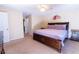 The bright main bedroom features a king bed, a ceiling fan, and an ensuite bathroom at 2974 Michelle Lee Dr, Dacula, GA 30019