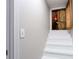 Attic access with white-painted stairs at 5199 Mainstreet Park Dr, Stone Mountain, GA 30088