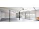 Spacious basement with three garage doors and concrete flooring at 5199 Mainstreet Park Dr, Stone Mountain, GA 30088