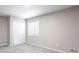 Bedroom with carpeting, neutral walls, and a double closet at 5199 Mainstreet Park Dr, Stone Mountain, GA 30088