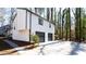 Two-story home featuring a two-car garage and manicured landscaping at 5199 Mainstreet Park Dr, Stone Mountain, GA 30088