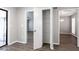 Hallway view showing a linen closet and access to other rooms in the house at 5199 Mainstreet Park Dr, Stone Mountain, GA 30088