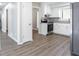 Spacious kitchen with stainless steel appliances, white cabinets, and ample countertop space at 5199 Mainstreet Park Dr, Stone Mountain, GA 30088