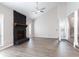 Stunning living room boasts a fireplace with stone accents, vaulted ceiling, and LVP flooring at 5199 Mainstreet Park Dr, Stone Mountain, GA 30088
