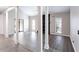 Open living room with neutral paint, abundant natural light and luxury vinyl plank flooring at 5199 Mainstreet Park Dr, Stone Mountain, GA 30088
