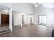 Bright living room with a vaulted ceiling, neutral paint, and luxury vinyl plank flooring at 5199 Mainstreet Park Dr, Stone Mountain, GA 30088