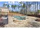 Backyard with a luxurious pool, hot tub, and outdoor furniture, perfect for relaxation at 798 Indian Hills Pkwy, Marietta, GA 30068