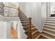 Elegant staircase features hardwood treads, iron balusters, and neutral wall paint at 798 Indian Hills Pkwy, Marietta, GA 30068