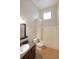 Bright bathroom featuring a shower-tub, modern fixtures, and granite countertop sink at 837 Forrest Se Cir, Atlanta, GA 30354