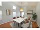 Elegant dining room with modern lighting, large windows, and hardwood floors at 837 Forrest Se Cir, Atlanta, GA 30354