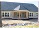 Spacious covered back porch with outdoor lighting and beautiful backyard views at 1883 Bennett Rdg, Snellville, GA 30078