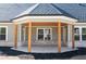 Inviting covered back porch with stylish columns, perfect for outdoor living at 1883 Bennett Rdg, Snellville, GA 30078