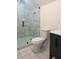 Modern bathroom features a glass shower with stylish tile and a toilet at 1883 Bennett Rdg, Snellville, GA 30078
