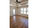 Bright and airy bedroom featuring hardwood floors, large windows, and a glass patio door for natural light at 1883 Bennett Rdg, Snellville, GA 30078