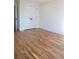 Bright bedroom showcasing hardwood floors and double door closet at 1883 Bennett Rdg, Snellville, GA 30078