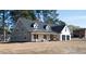 Charming two-story home with a welcoming front porch and attached two-car garage at 1883 Bennett Rdg, Snellville, GA 30078