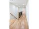 Hallway with hardwood flooring, modern railings, and recessed lighting at 1883 Bennett Rdg, Snellville, GA 30078