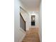 Hallway view showcasing hardwood floors and access to a modern bathroom, highlighting the home's stylish interior at 1883 Bennett Rdg, Snellville, GA 30078