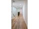 Well-lit hallway showcasing hardwood floors and access to multiple rooms at 1883 Bennett Rdg, Snellville, GA 30078