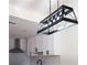 Modern kitchen with white cabinets, black hardware, stainless steel appliances, and a stylish pendant light at 1883 Bennett Rdg, Snellville, GA 30078