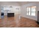 Open living space with hardwood floors, an island, a modern kitchen, and a fireplace at 1883 Bennett Rdg, Snellville, GA 30078