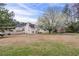 Expansive backyard with a large tree and well-maintained lawn, perfect for outdoor activities and relaxation at 5589 Claridge Cir, Lithonia, GA 30038