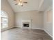 Spacious living room featuring a fireplace, large windows, and wood-look floors at 5589 Claridge Cir, Lithonia, GA 30038